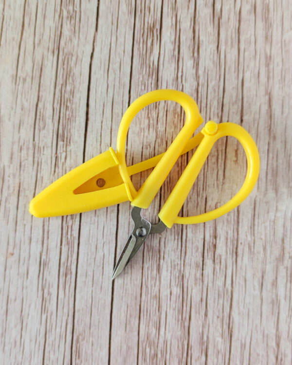 Ciseaux mini avec capuchon jaune